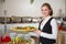 Catering service employee posing with tray for buffett