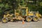 A Caterpillar 160H Motor Grader parked on a road in the Nez Perce National Forest, Idaho, USA - July 26, 2021