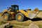 Caterpillar front end loader carrying sand