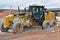 Caterpillar motor grader sits idle