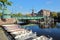 Catharijnebrug Bridge over Spaarne river with Molen De Adriaan windmill in the background and mooring boats in the foreground