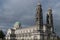 Cathedral Christ The King against dark grey sky.