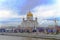 Cathedral of Christ the Savior. Moscow. Temple and golden domes on the background of the big city. Gloomy blue sky with clouds