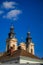 Cathedral church tower architecture religion building roof top view, vertical photography on blue sky background