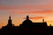 Cathedral dome silhouette in evening sunset dusk orange sky outdoor scenic background view