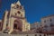 Cathedral facade and old buildings on a deserted square