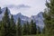 Cathedral Group in Grand Teton National Park rise above a forest