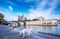 Cathedral of Notre Dame de Paris sunny autumn afternoon. Embankment of the Seine River. Two domestics dogs take a walk and relax