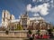 The Cathedral of Notre Dame in Paris, France, with a boat of tourists in the foreground