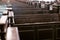 Cathedral pews. Rows of benches in christian church. Heavy solid uncomfortable wooden seats