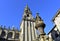 Cathedral, romanesque Platerias facade and baroque clock tower with stone horses fountain. Santiago de Compostela, Spain.