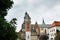 Cathedral and towers of Wawel castle residency in park landscape in Krakow, Poland