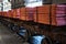 Cathode copper sheets on rail carriages in warehouse