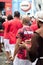 Catholic and Candomble people are seen dressed in red clothes during a party for Santa Barbara in Pelourinho