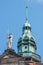 Catholic Cathedral of Holy Trinity, Hofkirche in downtown of Dresden and a statue of medieval knight in summer sunny day with blue