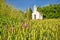 Catholic chapel in rural agricultural landscape