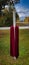 Catholic Christian cross with red garment hanging symbolizing the religious faith and crucifix of Jesus Christ