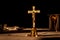 Catholic cross on altar in church lit by sunlight