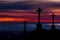 Catholic crosses silhouette with a darkness`s sunset background. We live in dangerous times, this Easter stay home and pray for th