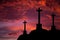 Catholic crosses silhouette with a darkness`s sunset background. We live in dangerous times, this Easter stay home and pray for th