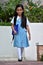 Catholic Diverse Female Student Standing Wearing School Uniform With Books