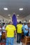 Catholic faithful carry the statue of Mary into the church during the Mass of the Passion of Christ