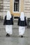 Catholic nuns in white habits walking