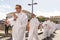 Catholic priests participate in the corpus christi procession in the streets of Pelourinho, Salvador, Bahia