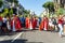 Catholic priests and worshipers walk together during the Palm Sunday procession