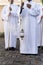 Catholic seminarians are seen with a cross and incense during an open-air Mass on Palm Sunday