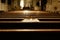 Catholic woman alone praying prostrate inside a Christian temple