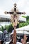 Catholics touching the image of Jesus Christ during mass at Senhor do Bonfim church