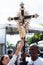 Catholics touching the image of Jesus Christ during mass at Senhor do Bonfim church