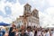 Catholics touching the image of Jesus Christ during mass at Senhor do Bonfim church, in the background