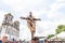 Catholics touching the image of Jesus Christ during mass at Senhor do Bonfim church, in the background