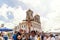 Catholics touching the image of Jesus Christ during mass at Senhor do Bonfim church, in the background