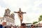 Catholics touching the image of Jesus Christ during mass at Senhor do Bonfim church, in the background