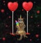 Caticorn swinging on red balloons