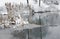 Cattail stalks in a frozen pond covered in fresh snow.