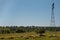 Cattle of cows in the meadow with wind water well