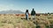 Cattle, farm and people walking on sustainable agriculture land together and planning organic field harvesting