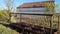 Cattle Feeder Behind North Texas Hay Barn