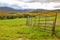 Cattle Gate by Field in Mountains