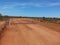 Cattle grid on gravel road in Australian Outback desert