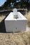 Cattle trough painted white and restored