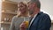 Caucasian adults man and woman middle-aged talking husband and wife family couple talk drink juice shopping online