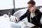 Caucasian attentive businessman alone in restaurant, waiting for investors or business partners