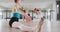 Caucasian ballet female dancers stretching up with a barre before a ballet class