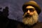Caucasian beard man with a black hat and sunglasses against blurred dark sky in the evening