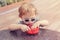 Caucasian blond preschool boy with sunglasses eating cereal meal food